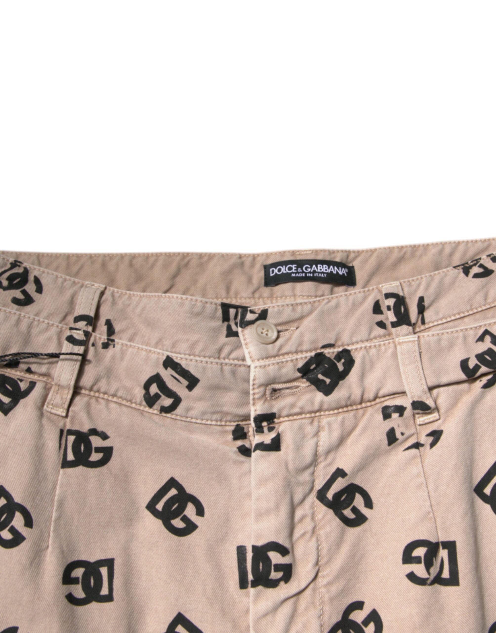 Jeans skinny en denim coton beige Dolce & Gabbana avec logo, visibles avec détails de couture et coupe ajustée.