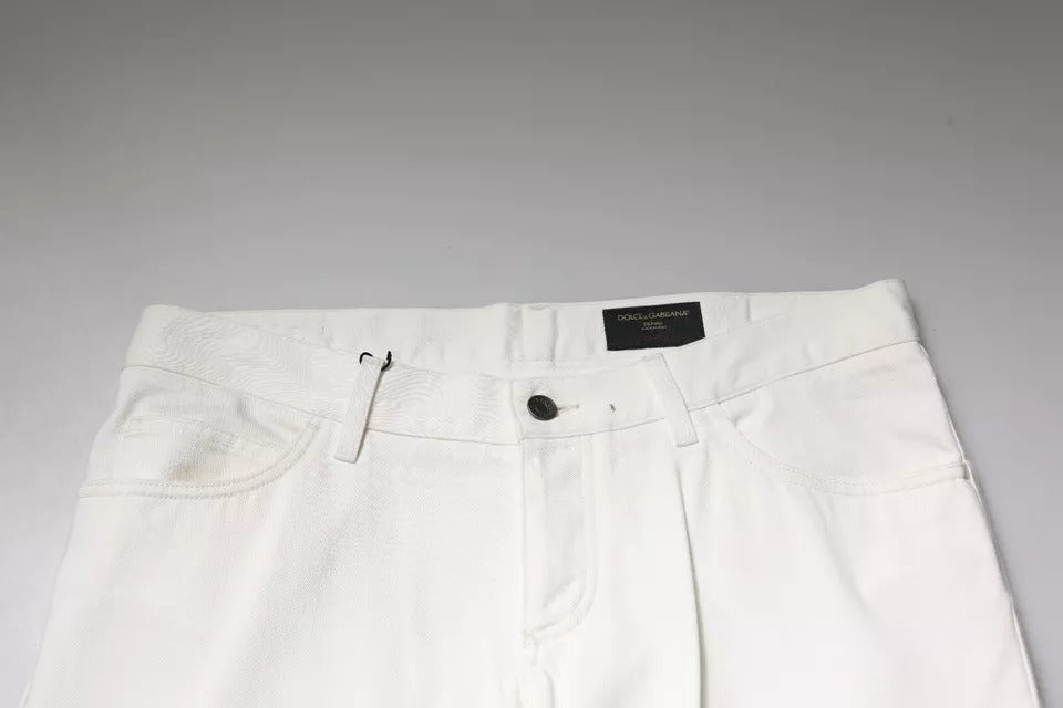 Jeans skinny en denim blanc en coton de Dolce & Gabbana, affichant une coupe ajustée et un style élégant.