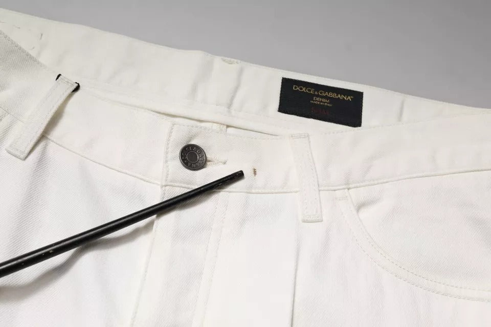 Jeans skinny en denim blanc en coton de Dolce & Gabbana, vue de face, détails du tissu et coupe ajustée visibles.