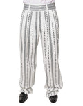 Pantalon droit blanc Dolce & Gabbana pour homme, style formel, en tissu élégant, visible en gros plan sur une mannequin.