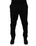 Pantalon de costume noir Dolce & Gabbana à coupe tapered, élégant et formel, en tissu classique, vue de devant.