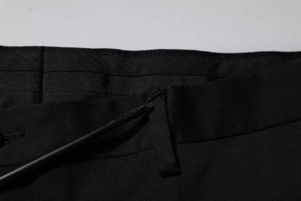 Pantalons de costume noirs Dolce & Gabbana, coupe tapered élégante, tissu de qualité pour occasions formelles, vue de face.