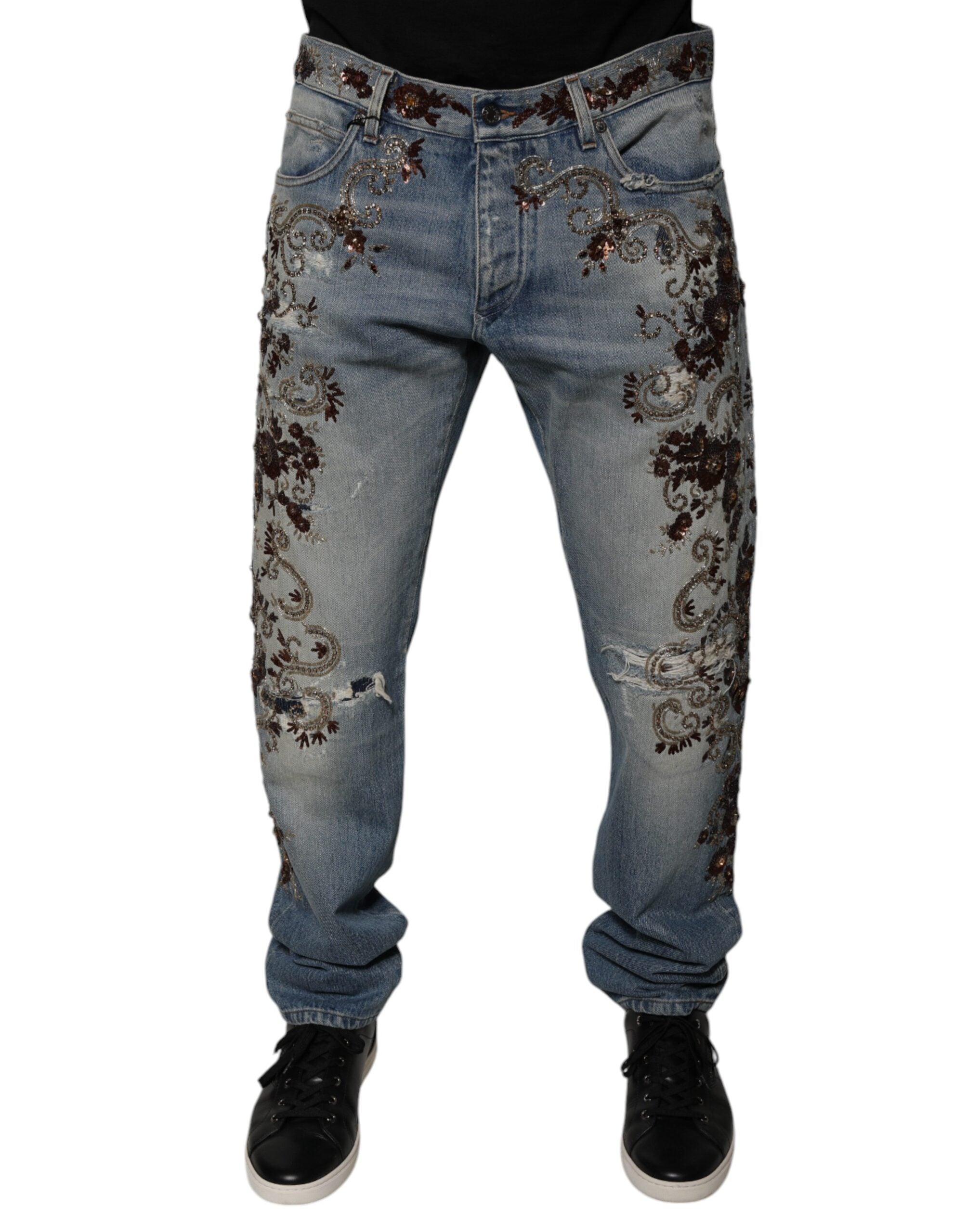 Jeans skinny en denim brodé Dolce & Gabbana Light Blue, coupe ajustée et détails élégants visibles en gros plan.