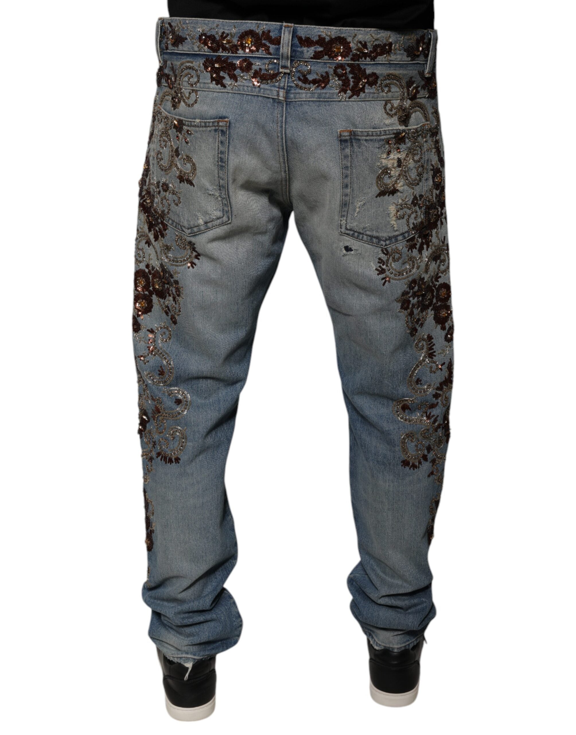 Jeans skinny en denim brodé Dolce & Gabbana Light Blue, coupe ajustée et détail de broderie sur le jean.