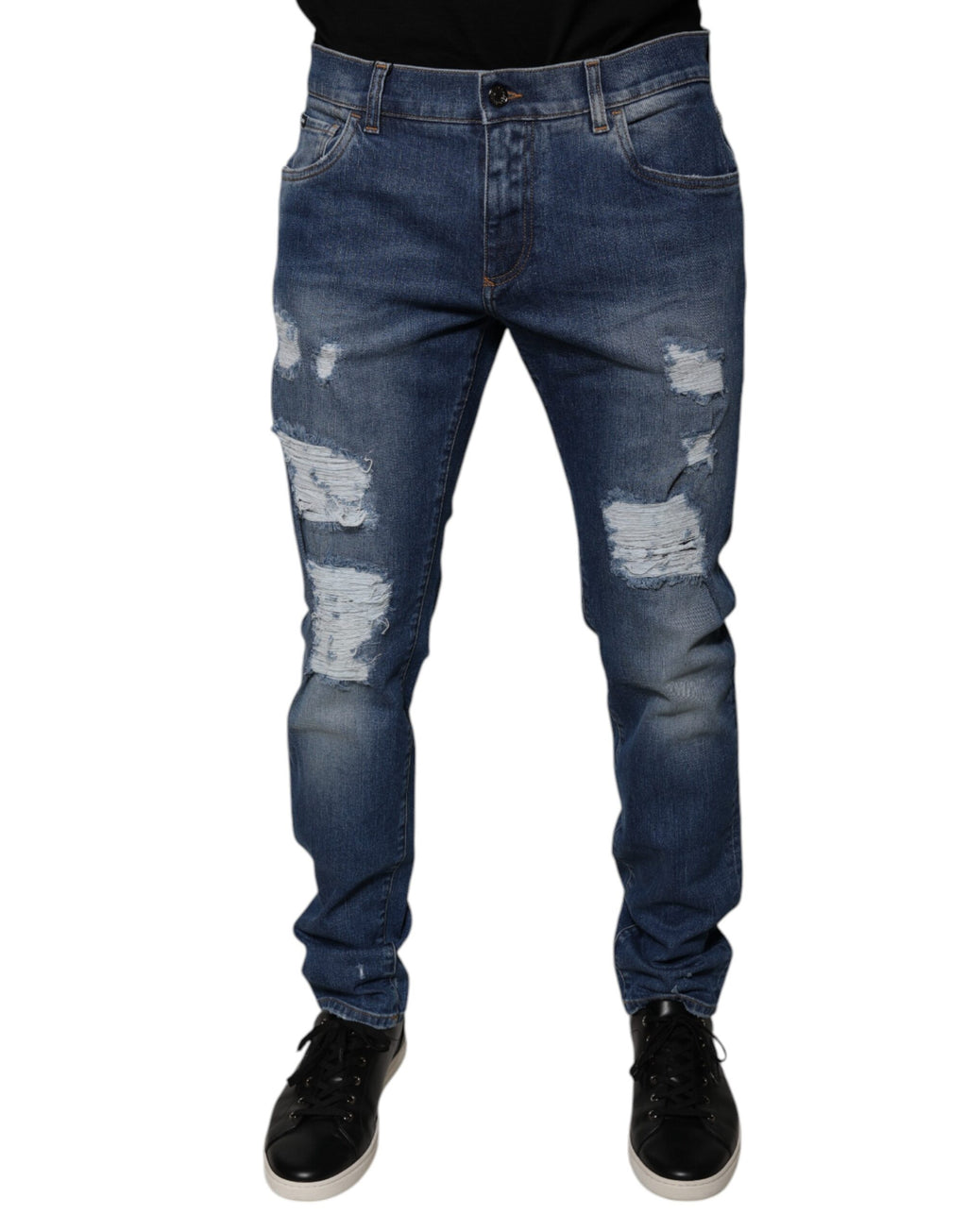 Jeans skinny en denim bleu tacheté en coton Dolce & Gabbana avec déchirures et finition usée, mode décontractée et tendance.