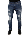 Jeans skinny en denim bleu tacheté en coton Dolce & Gabbana avec déchirures et finition usée, mode décontractée et tendance.