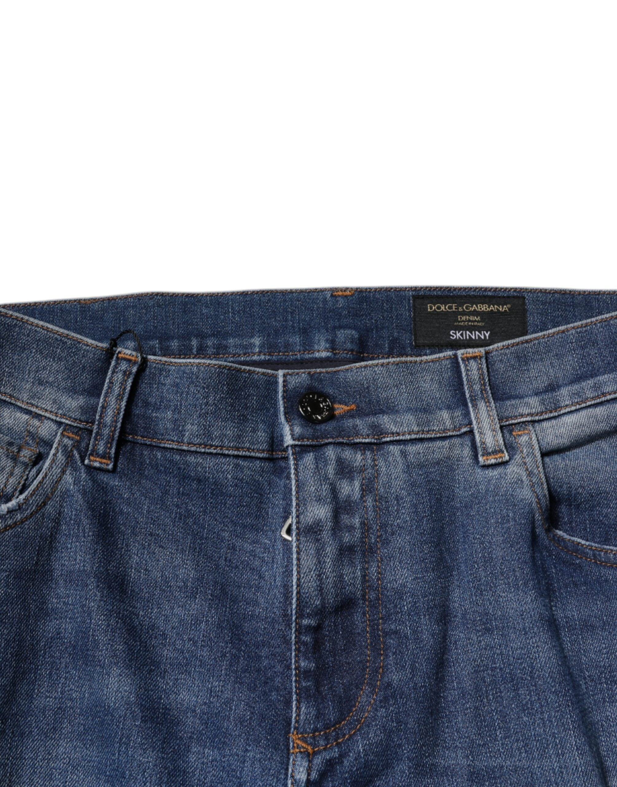 Jeans slim en denim coton bleu Dolce & Gabbana avec déchirures et style tattered, mode tendance et décontractée.