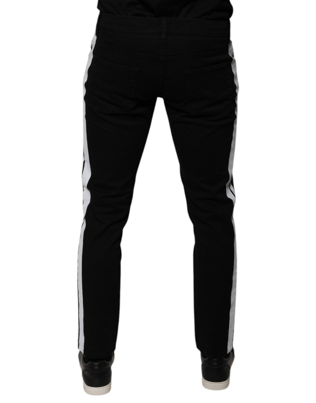 Jeans skinny Dolce & Gabbana noirs avec doublure blanche et motif couronne, visible devant, en denim de style élégant.