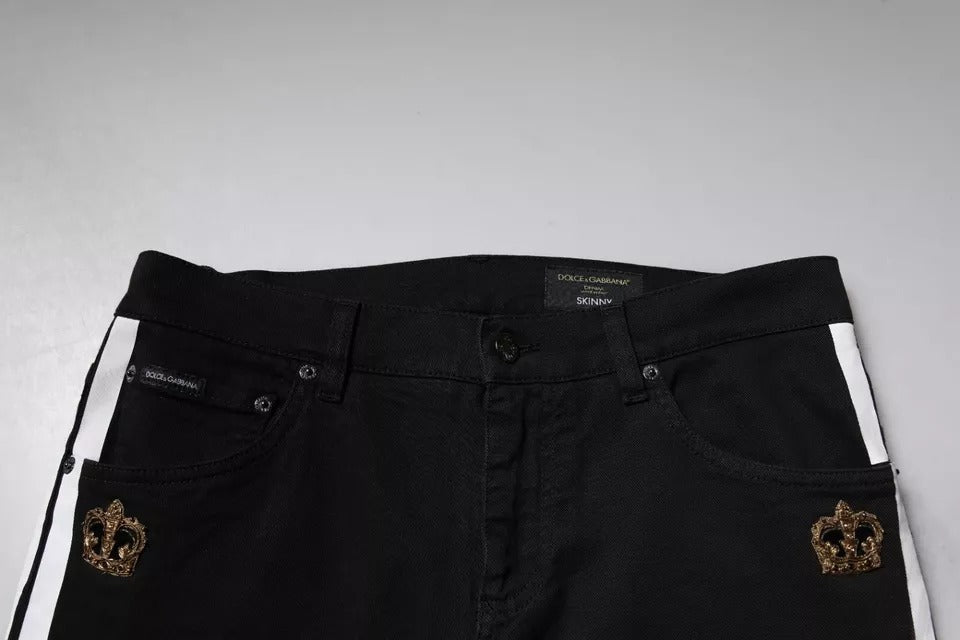 Jeans skinny Dolce & Gabbana noirs avec doublure blanche et motif de couronne, en denim ajusté et tendance.