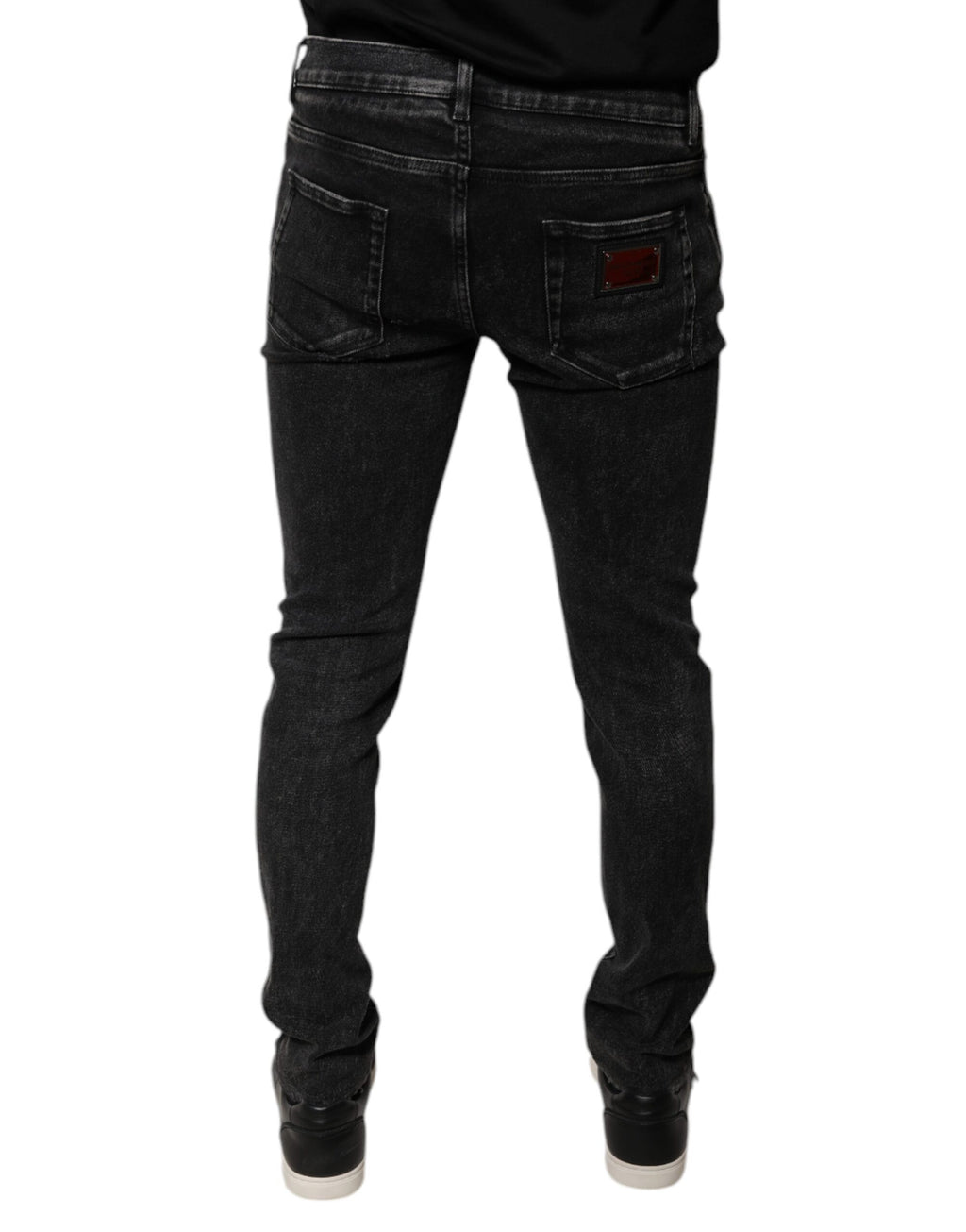Jeans homme Dolce & Gabbana en coton stretch noir, coupe skinny, denim épais et ajusté, visible sur l'image.