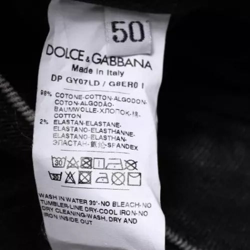 Jeans homme en denim noir Dolce & Gabbana en coton stretch, coupe skinny ajustée, visible sur l'image.