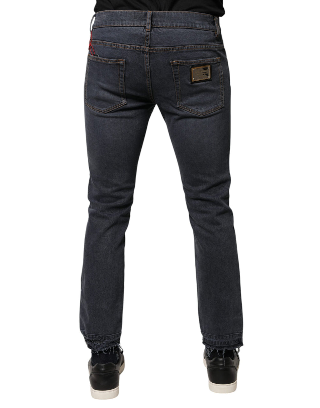 Jeans slim en denim coton gris foncé de Dolce & Gabbana, coupe ajustée et détails classiques, vue de face.