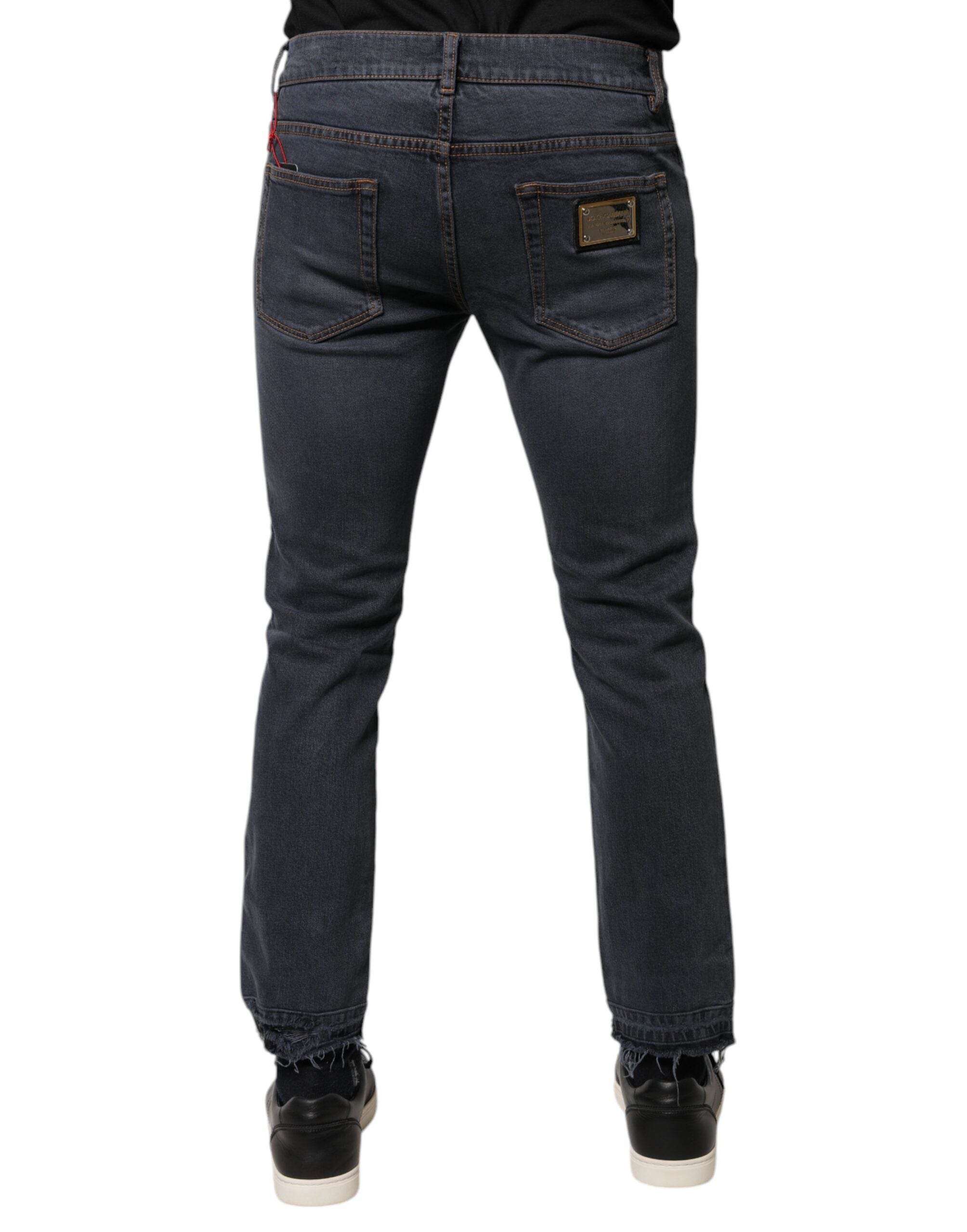 Jeans slim en denim coton gris foncé de Dolce & Gabbana, coupe ajustée et détails classiques, vue de face.