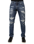Jeans skinny en denim tacheté bleu en coton de Dolce & Gabbana, design déchiré et mode tendance.