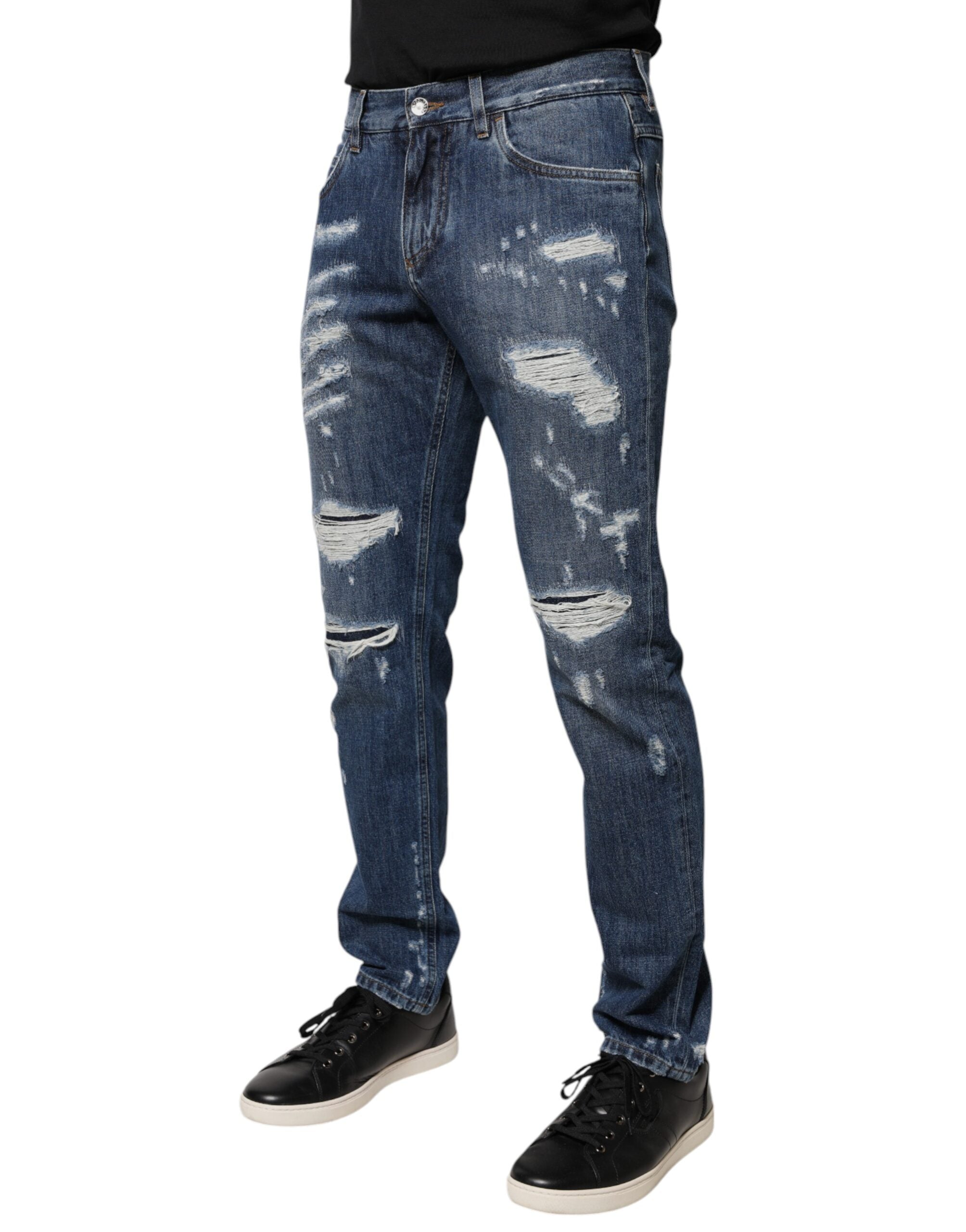 Jeans skinny déchirés en coton bleu Dolce & Gabbana, style tendance et tissu confortable pour homme ou femme.
