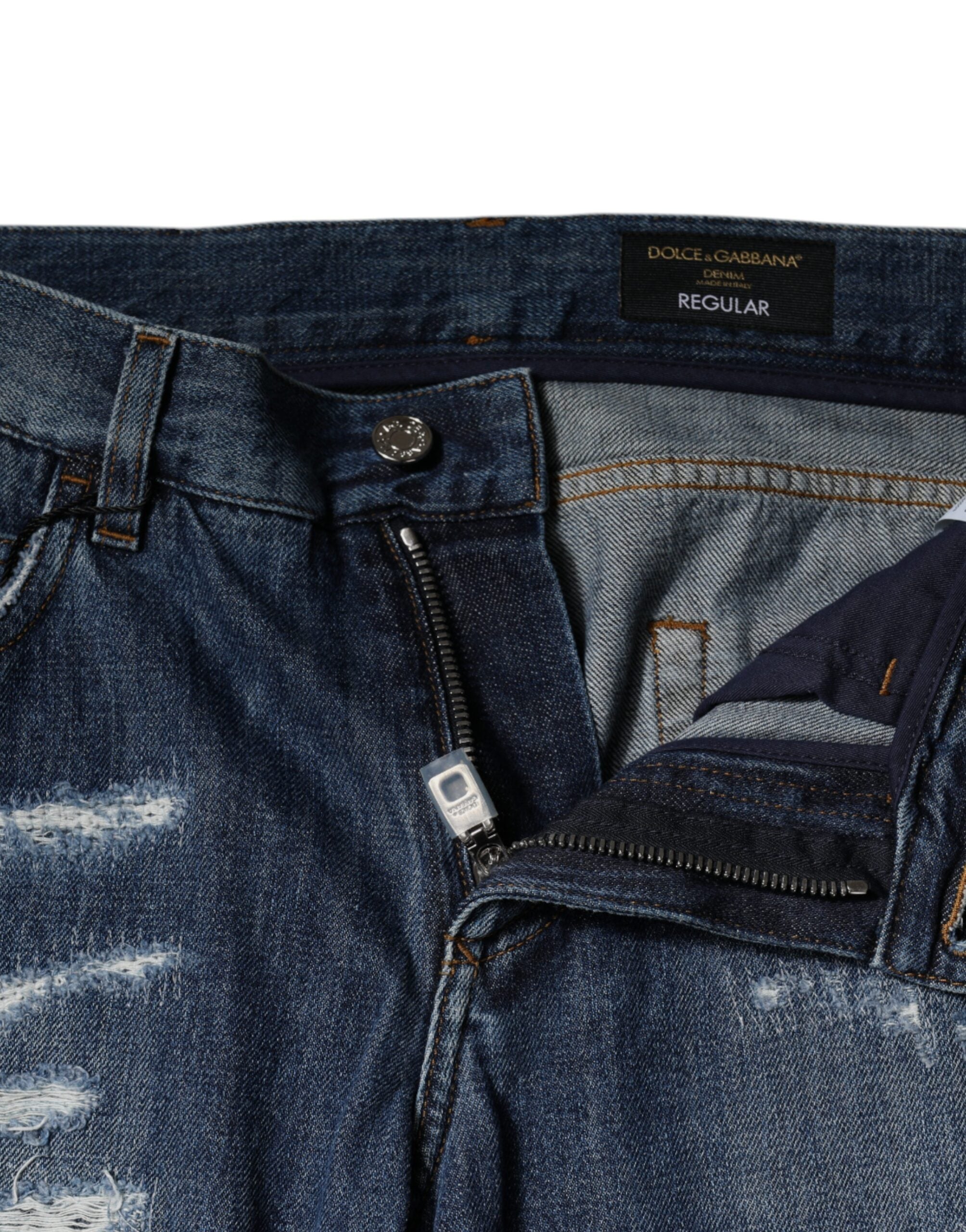 Jeans en denim skinny tachetés en coton bleu de Dolce & Gabbana, style décontracté et usé.