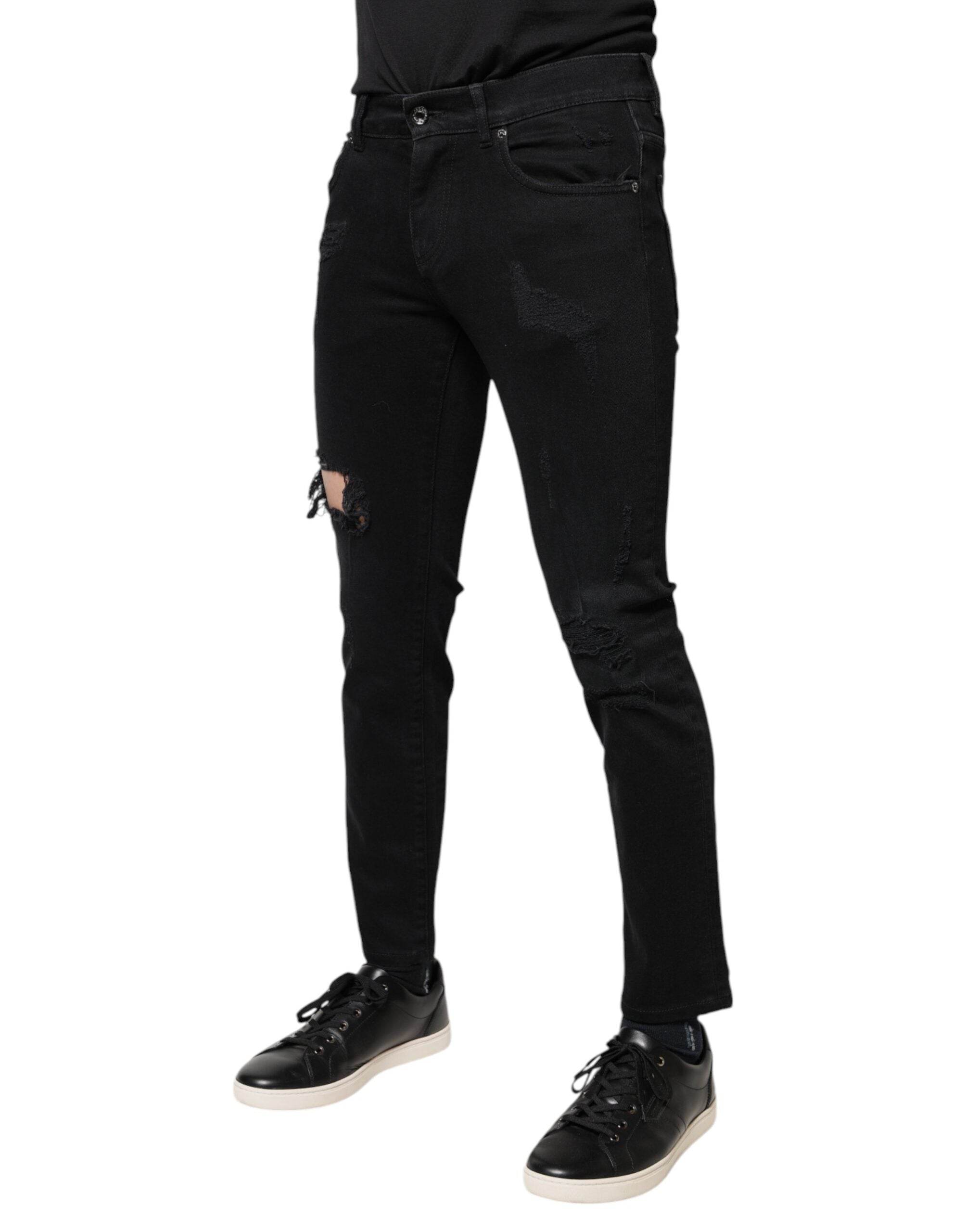 Jeans skinny en denim noir tâcheté avec logo Dolce & Gabbana en coton, style décontracté et tendance.