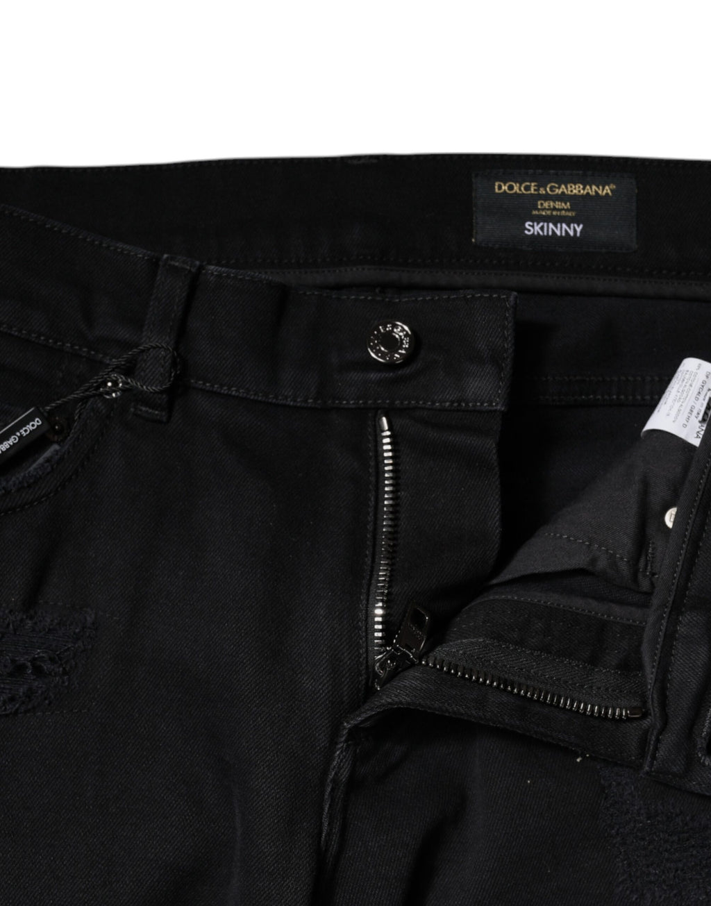 Jeans skinny en denim noir tacheté avec logo Dolce & Gabbana en coton, style décontracté et tendance.