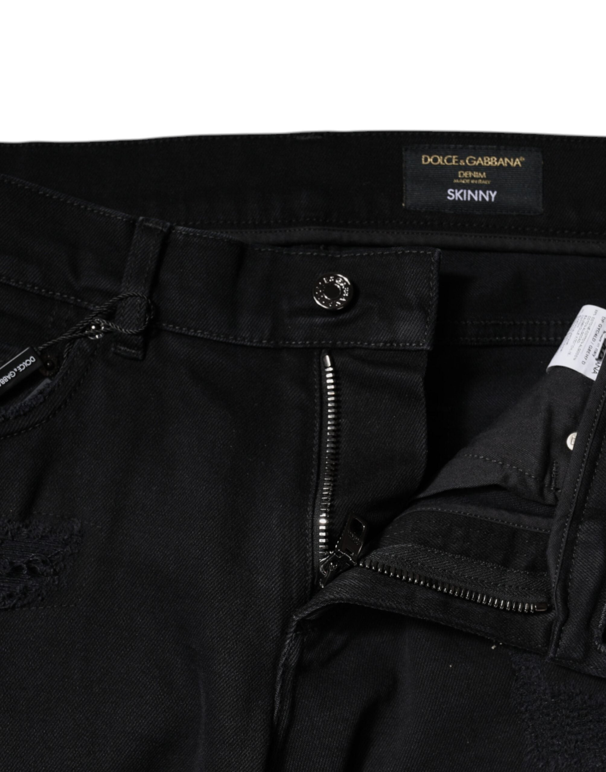 Jeans skinny en denim noir tacheté avec logo Dolce & Gabbana en coton, style décontracté et tendance.