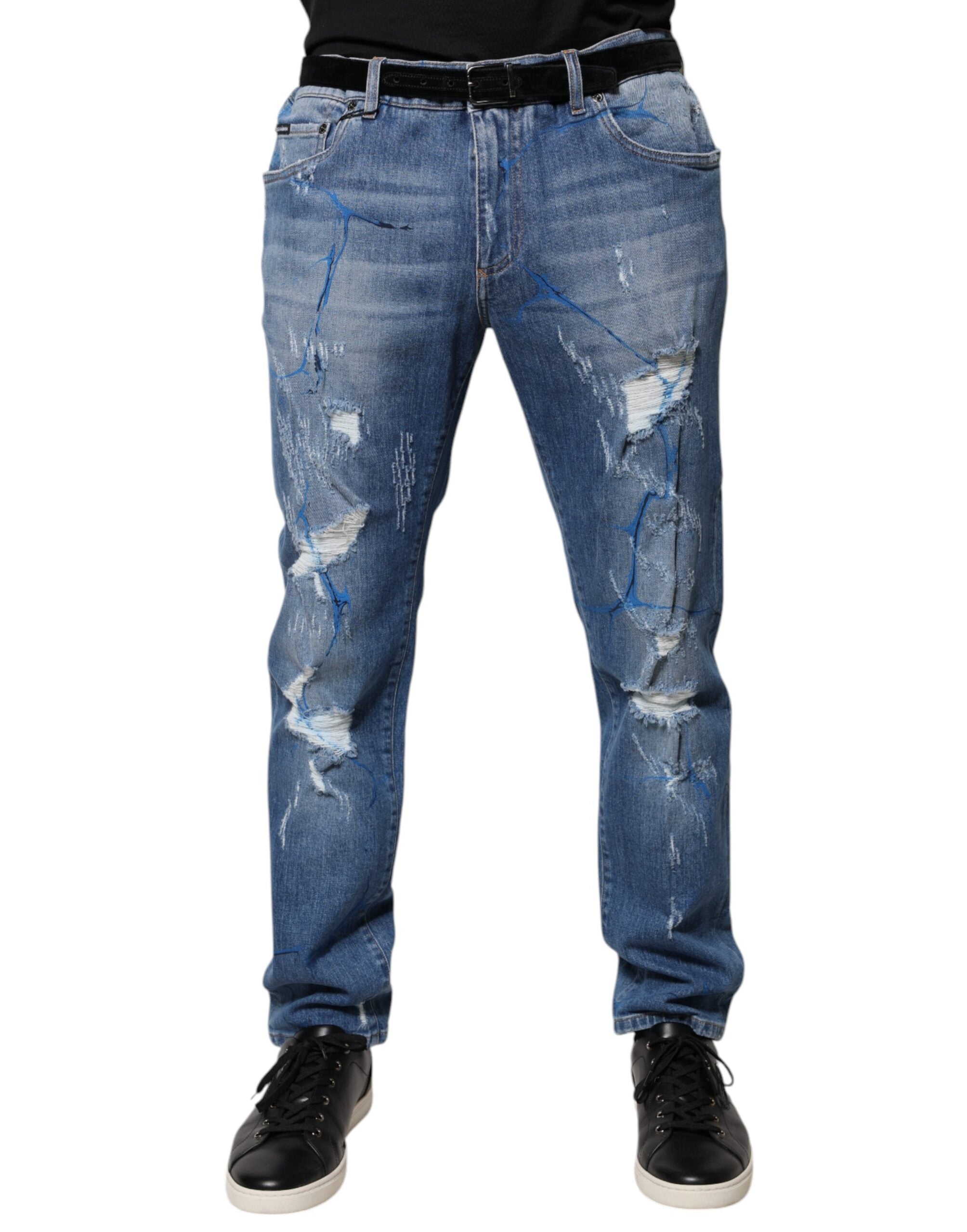 Jeans skinny déchirés en coton stretch bleu Dolce & Gabbana, style tattered, ajustés avec détails usés.