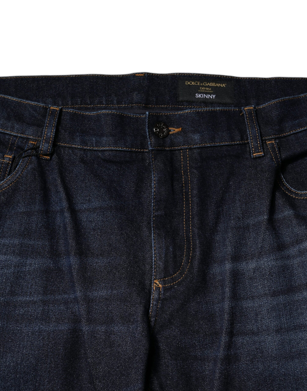 Jeans slim en denim coton bleu foncé de Dolce & Gabbana, coupe ajustée et détails classiques visibles sur l'image.