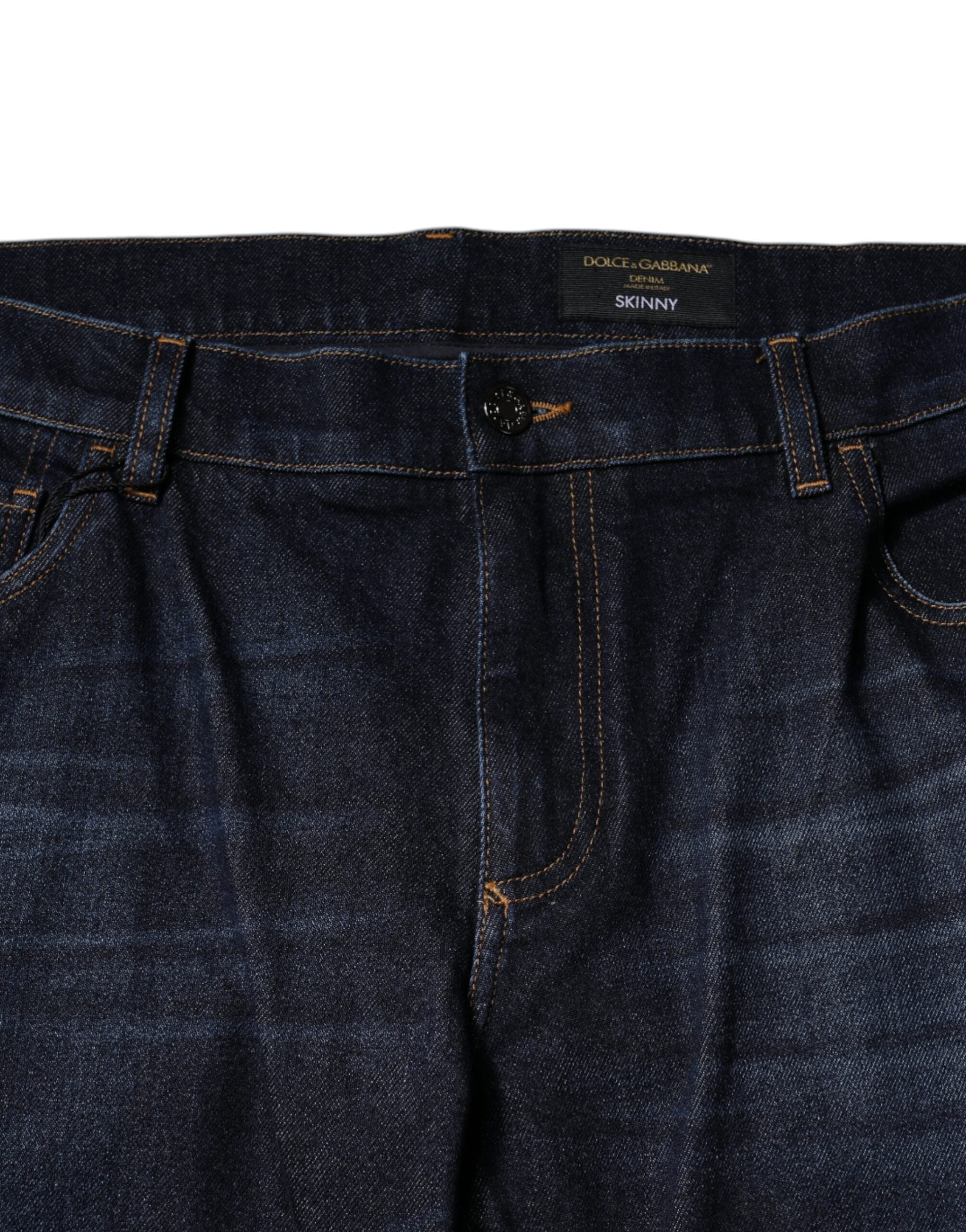 Jeans slim en denim coton bleu foncé de Dolce & Gabbana, coupe ajustée et détails classiques visibles sur l'image.