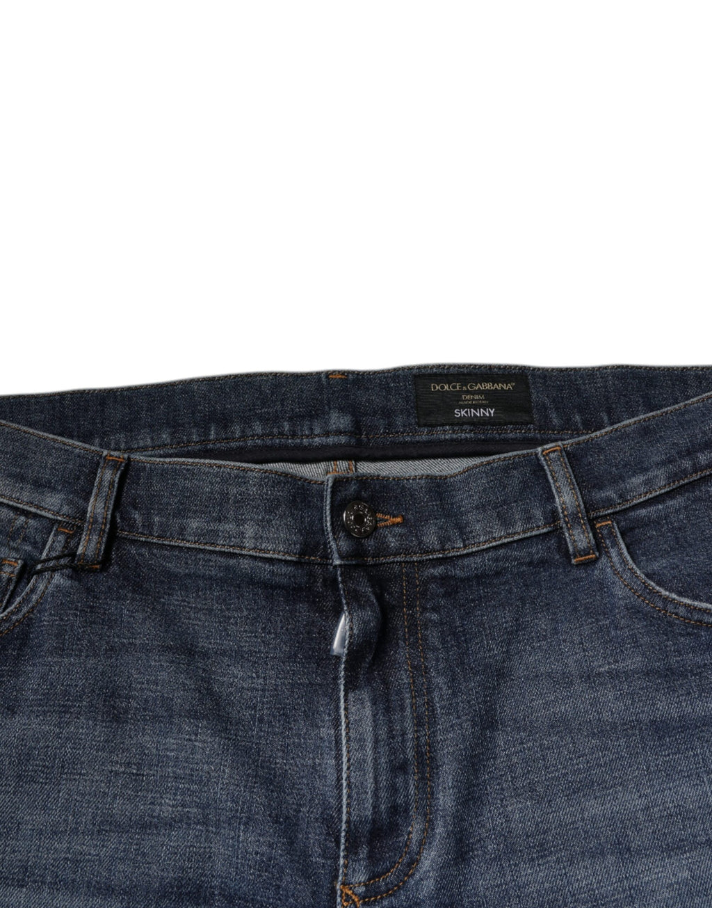 Jeans skinny en denim coton bleu foncé Dolce & Gabbana avec logo, ajustés et élégants, visibles sur l'image.