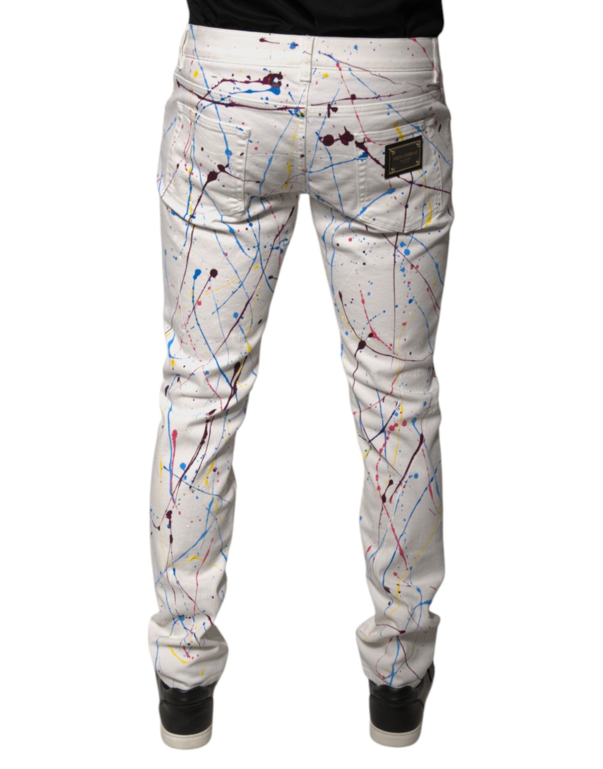 Jeans skinny en denim blanc à imprimé splash de couleur de Dolce & Gabbana.