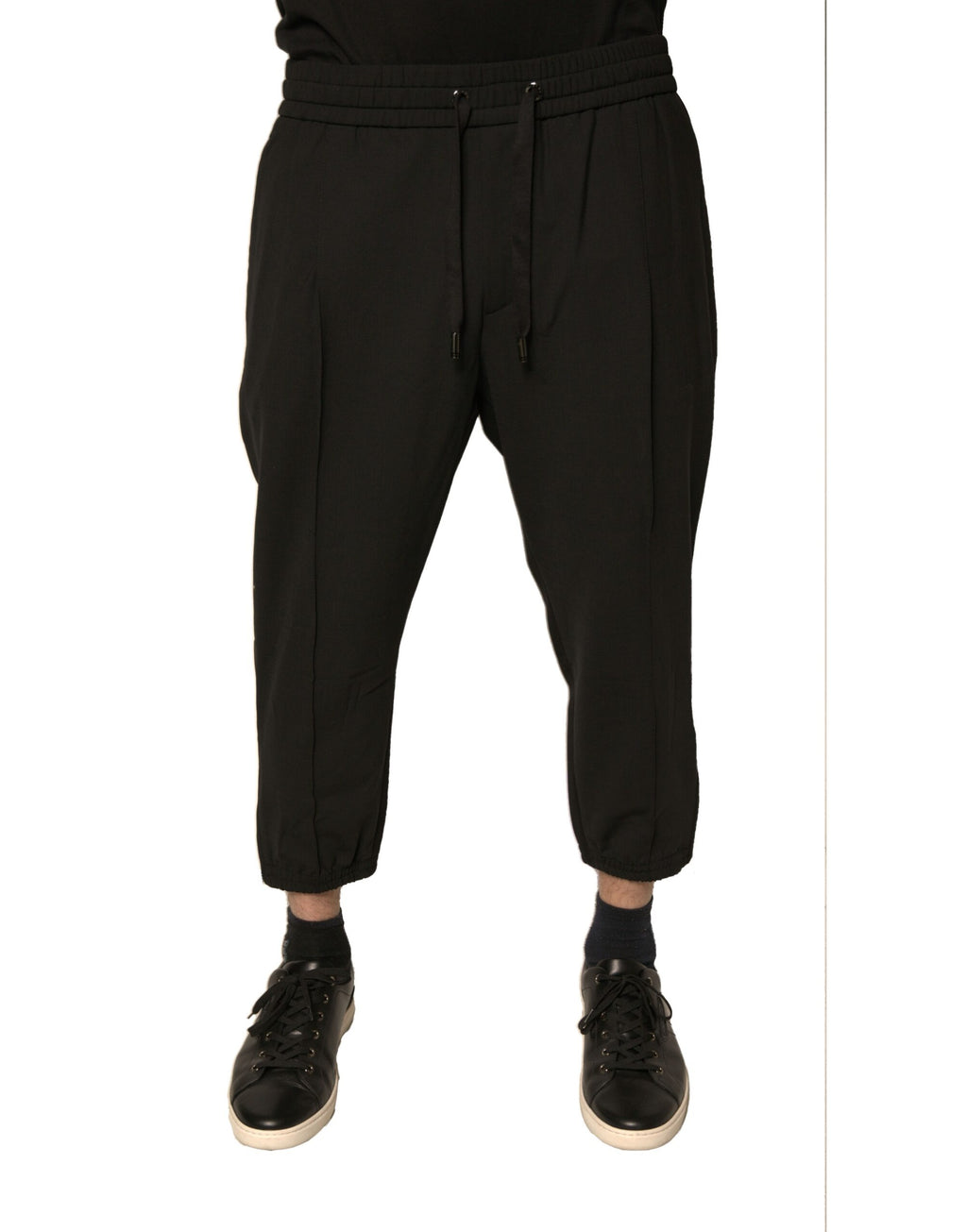 Pantalons de jogging en laine noire Dolce & Gabbana, style décontracté avec ceinture élastique et poches latérales.