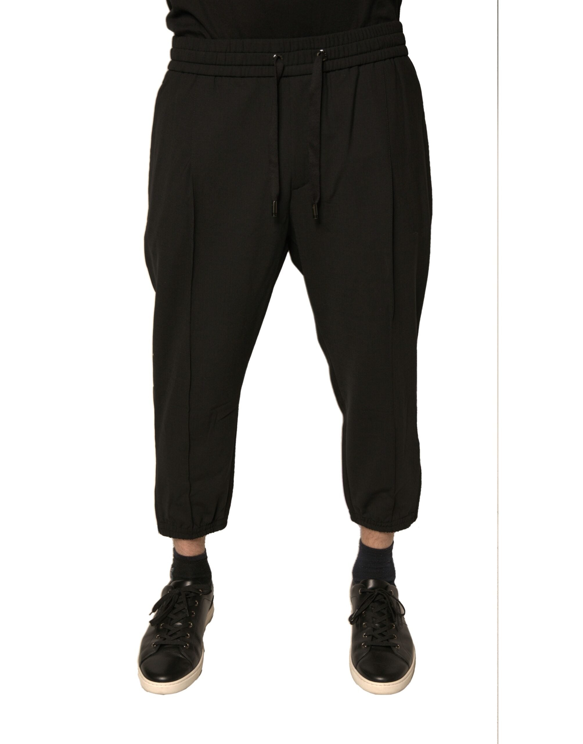 Pantalons de jogging en laine noire Dolce & Gabbana, style décontracté avec ceinture élastique et poches latérales.