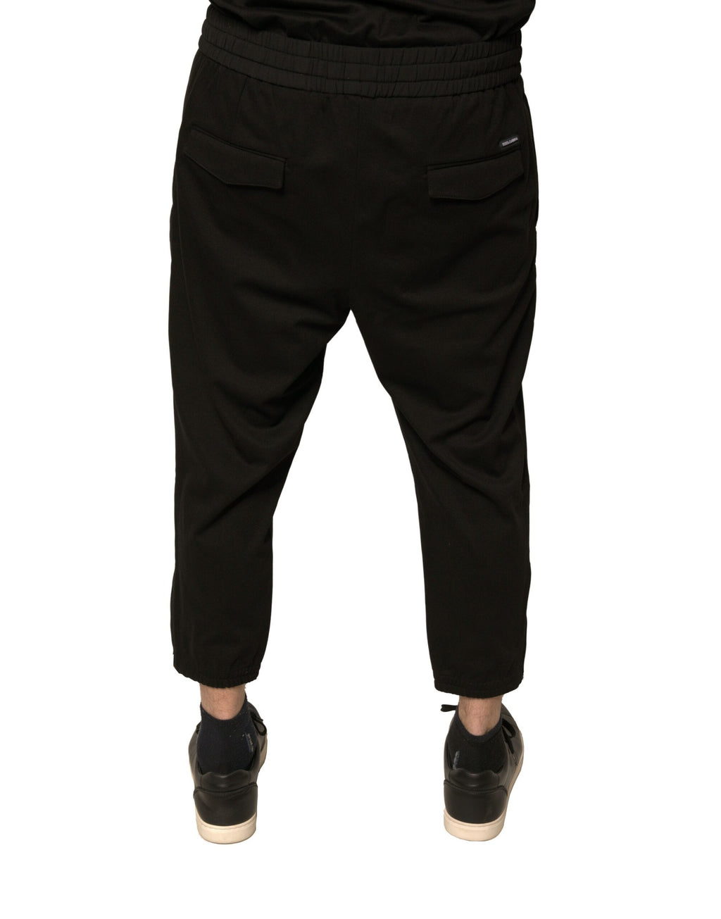 Pantalons jogging Dolce & Gabbana en laine noire, style décontracté et élégant, visibles avec détails de couture et ceinture élastique.
