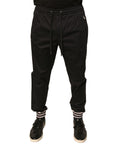 Pantalon de jogging Dolce & Gabbana en coton stretch noir, avec ceinture élastique et poches latérales, vue de face.