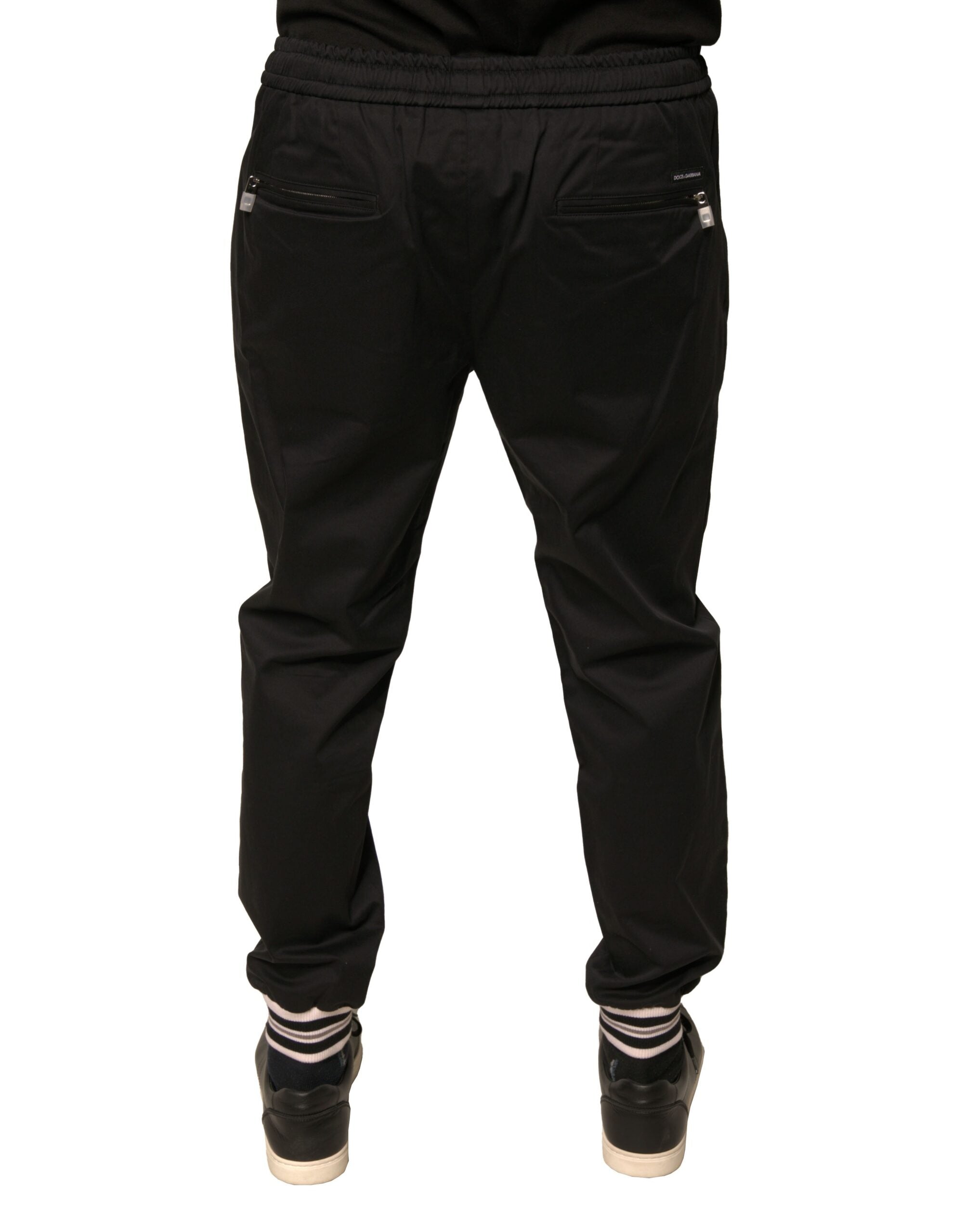 Pantalons de jogging Dolce & Gabbana en coton noir avec ceinture élastique et poches latérales, style décontracté et élégant.