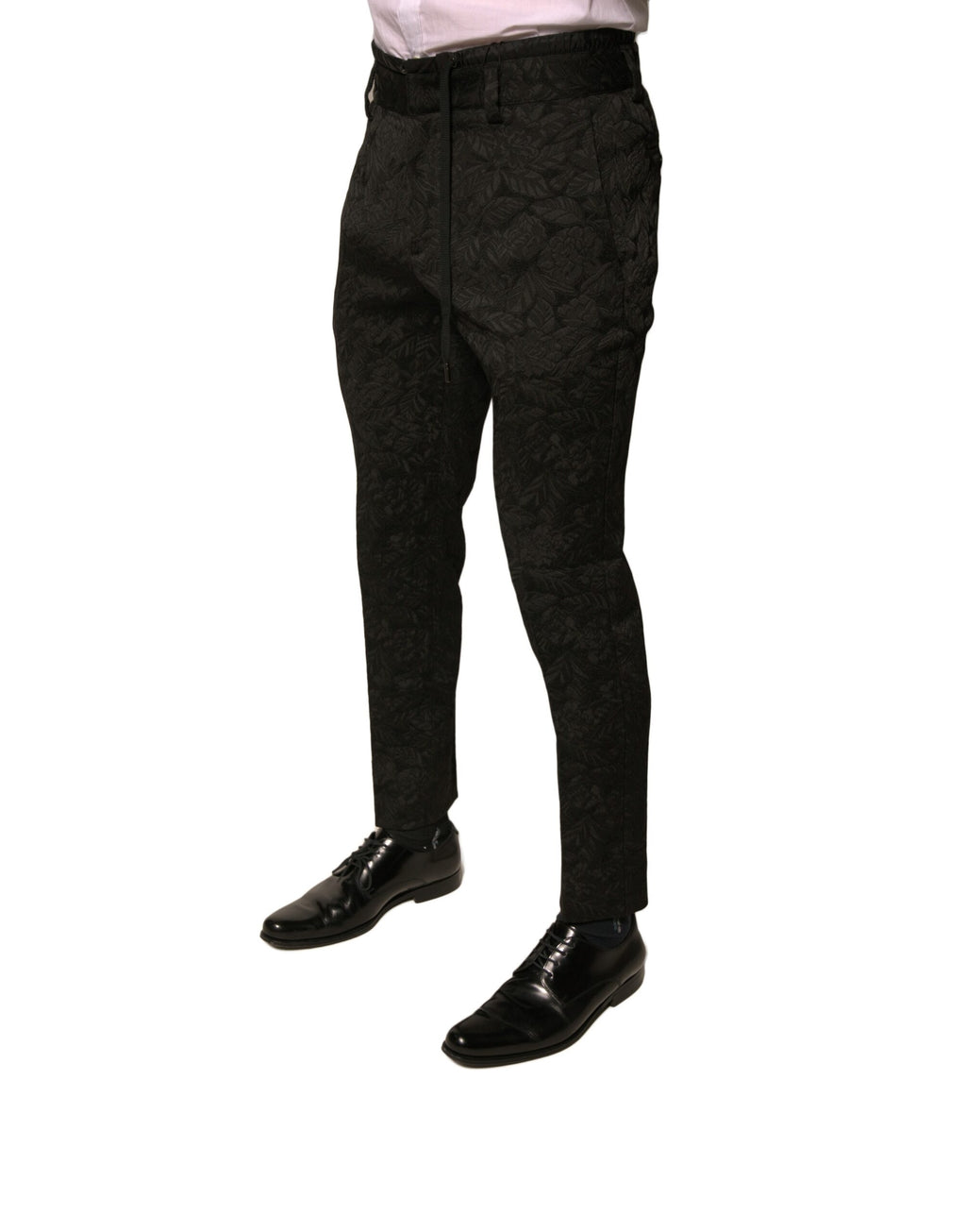 Pantalon slim noir en brocart en polyester de la marque Dolce & Gabbana pour homme, vue de face.