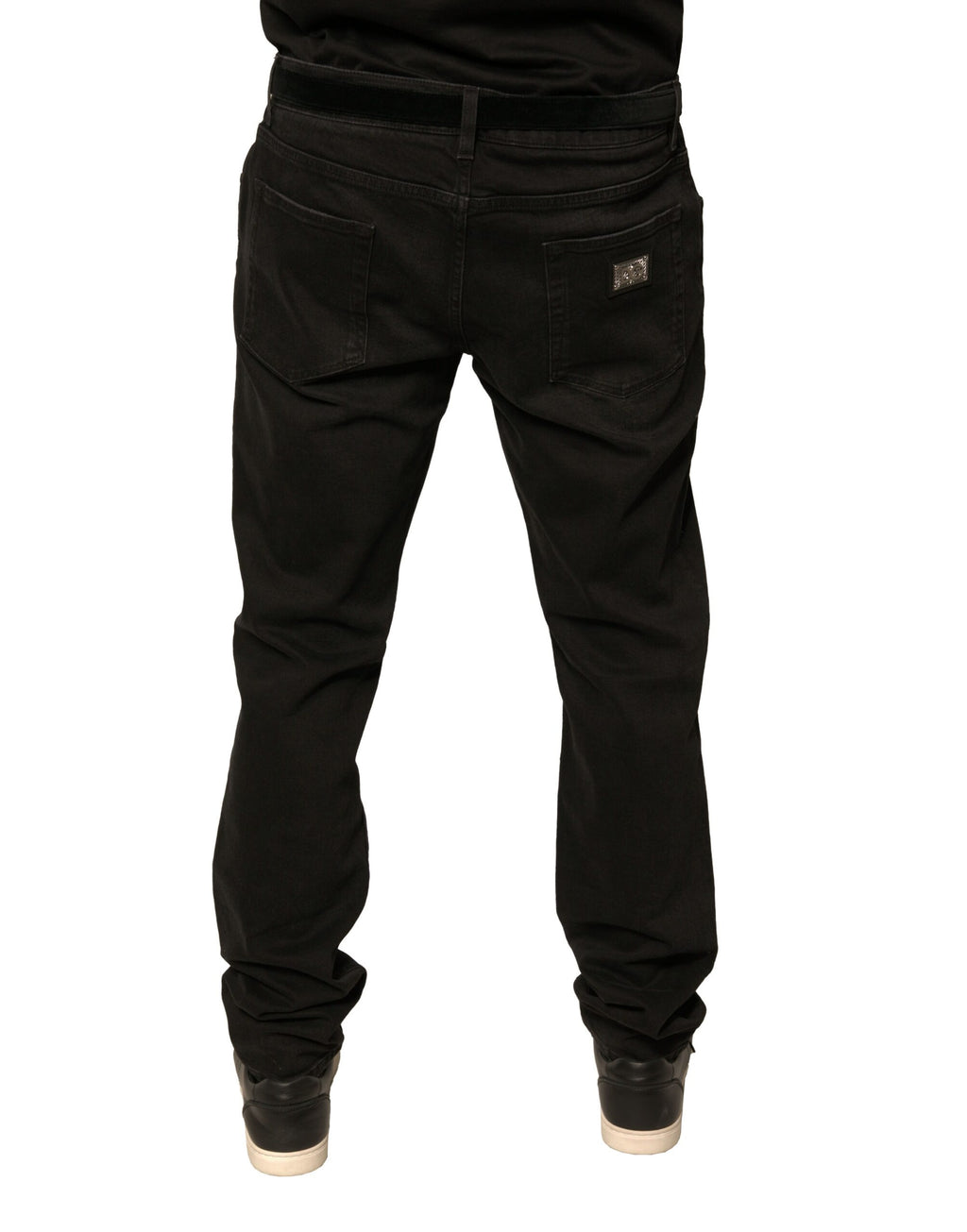 Jeans skinny en denim noir Dolce & Gabbana avec déchirures et logo en coton, vêtement tendance pour homme ou femme.