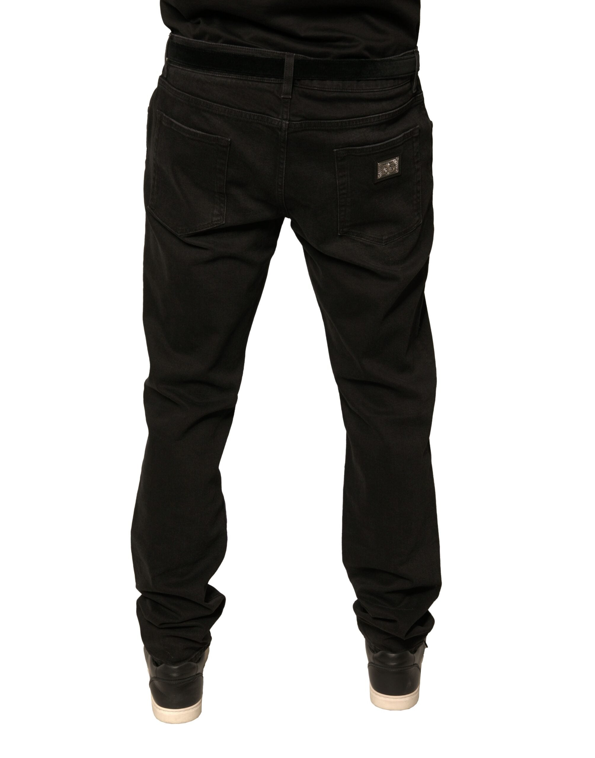 Jeans skinny en denim noir Dolce & Gabbana avec déchirures et logo en coton, vêtement tendance pour homme ou femme.