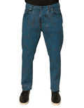 Jeans skinny en denim coton stretch bleu Dolce & Gabbana avec logo, visible en détail sur l'image.