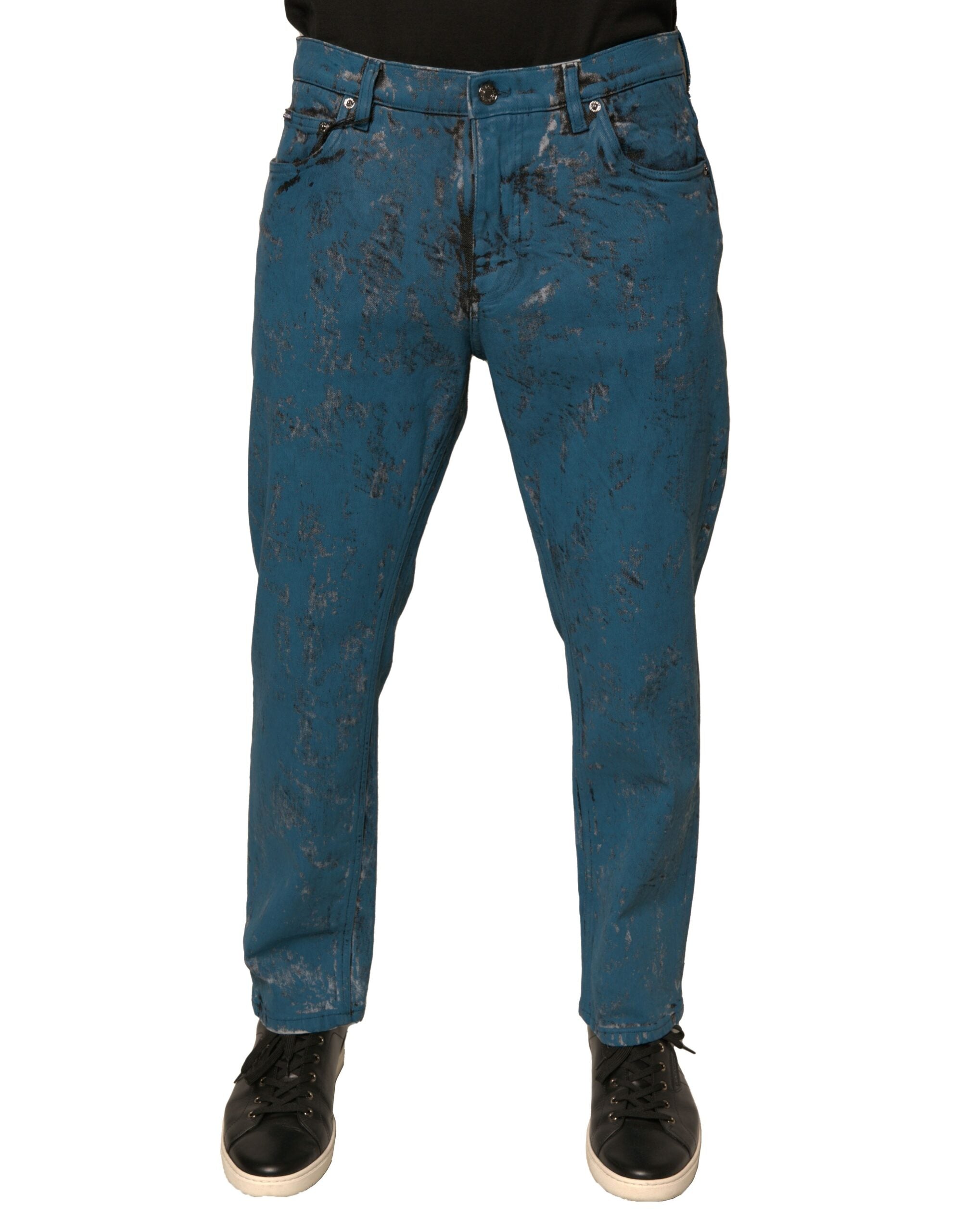 Jeans skinny en denim coton stretch bleu Dolce & Gabbana avec logo, visible en détail sur l'image.