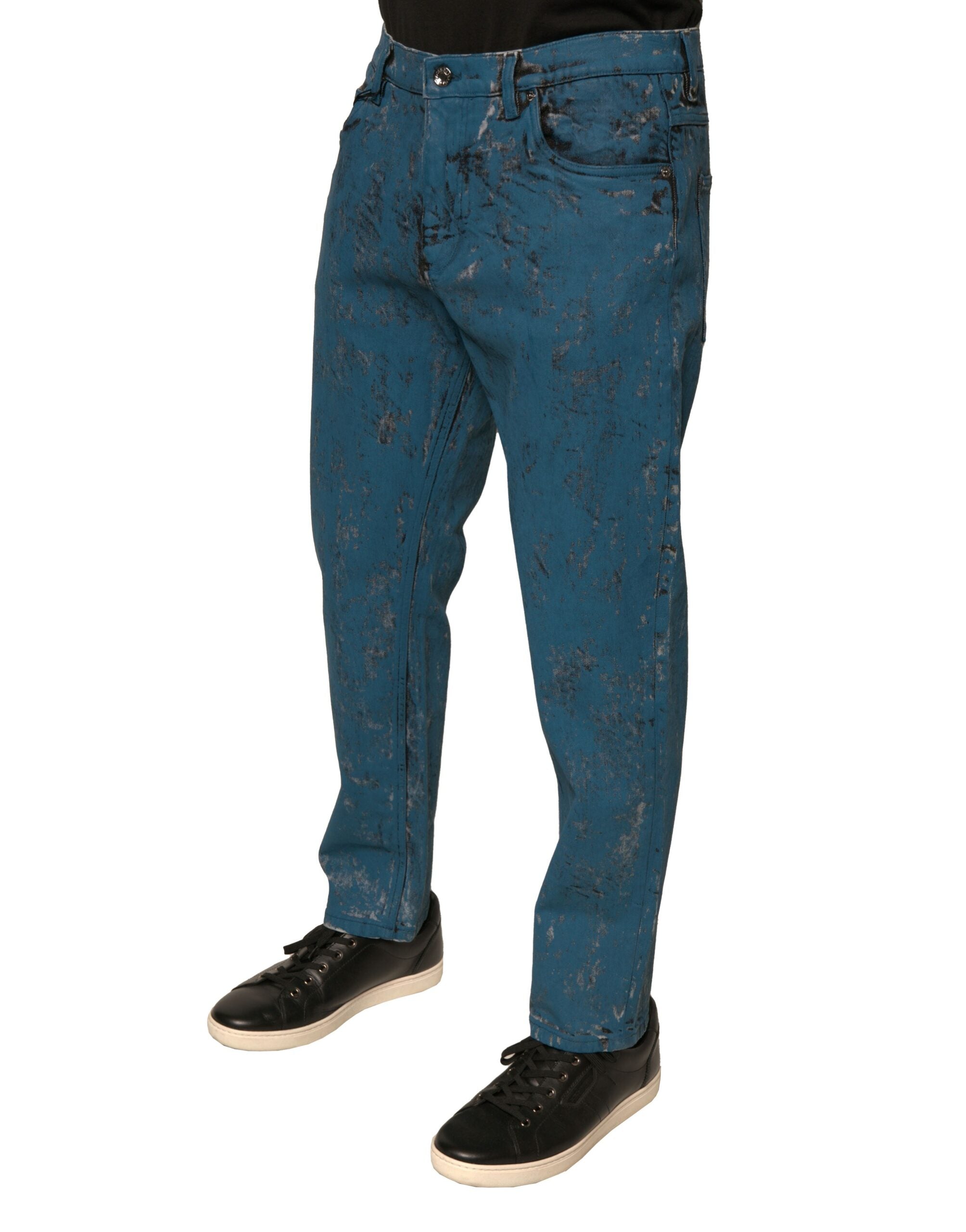 Jeans skinny en denim extensible en coton bleu Dolce & Gabbana avec logo, visibles sur l'image.
