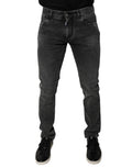 Pantalons en jean skinny noir Dolce & Gabbana avec logo en coton stretch, ajustés et modernes, visibles sur l'image.