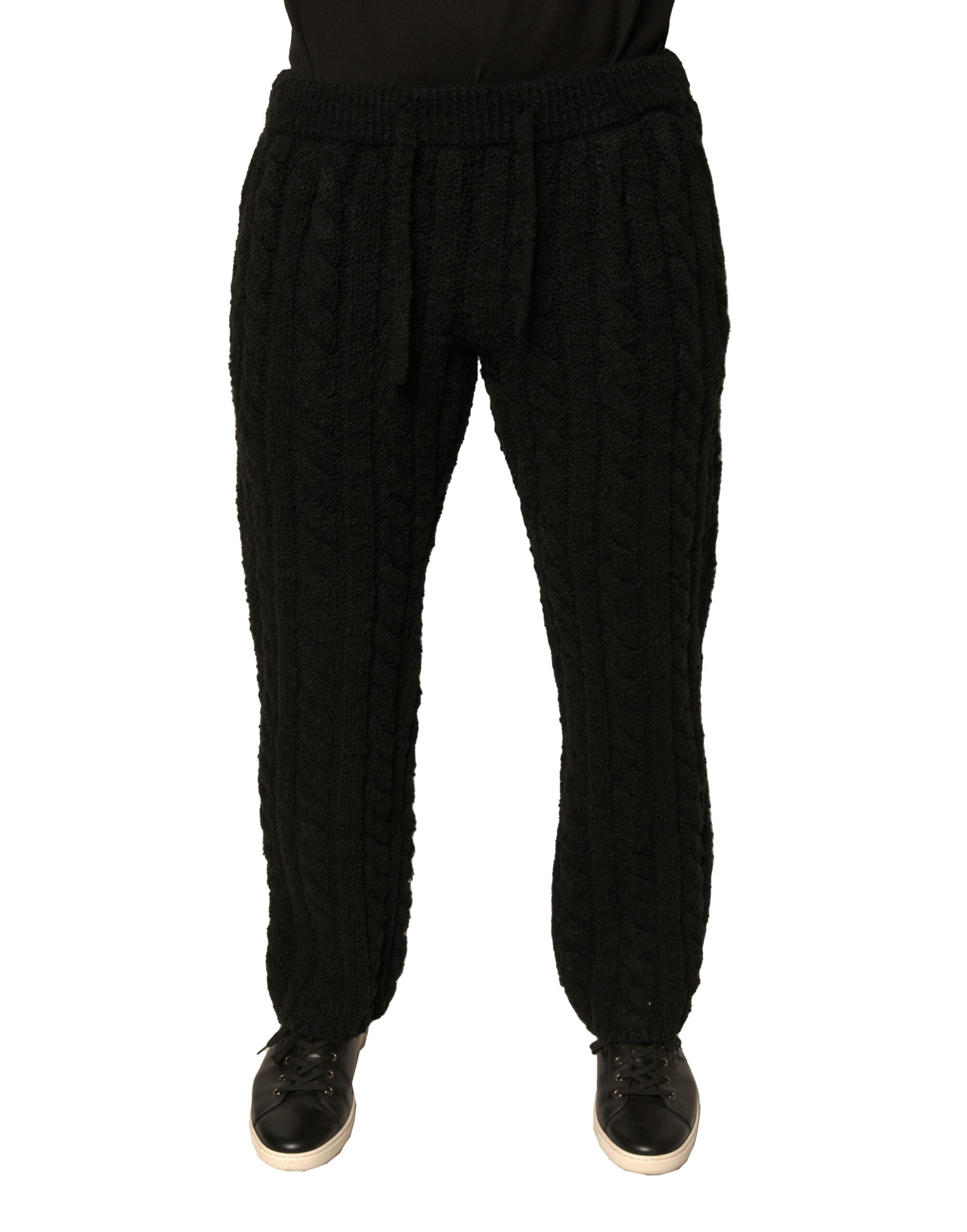 Pantalons skinny en laine noire de Dolce & Gabbana, coupe ajustée et tricotée, vue de face sur un fond neutre.