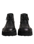Bottes noires en cuir avec lacets à la cheville de la marque Dolce & Gabbana, chaussures élégantes en cuir noir.