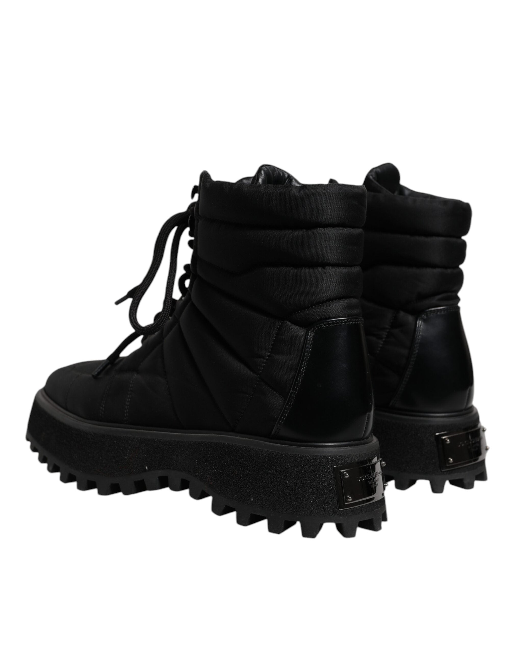 Bottes noires Dolce & Gabbana en rembourrage mi-mollet avec lacets, style élégant et moderne.