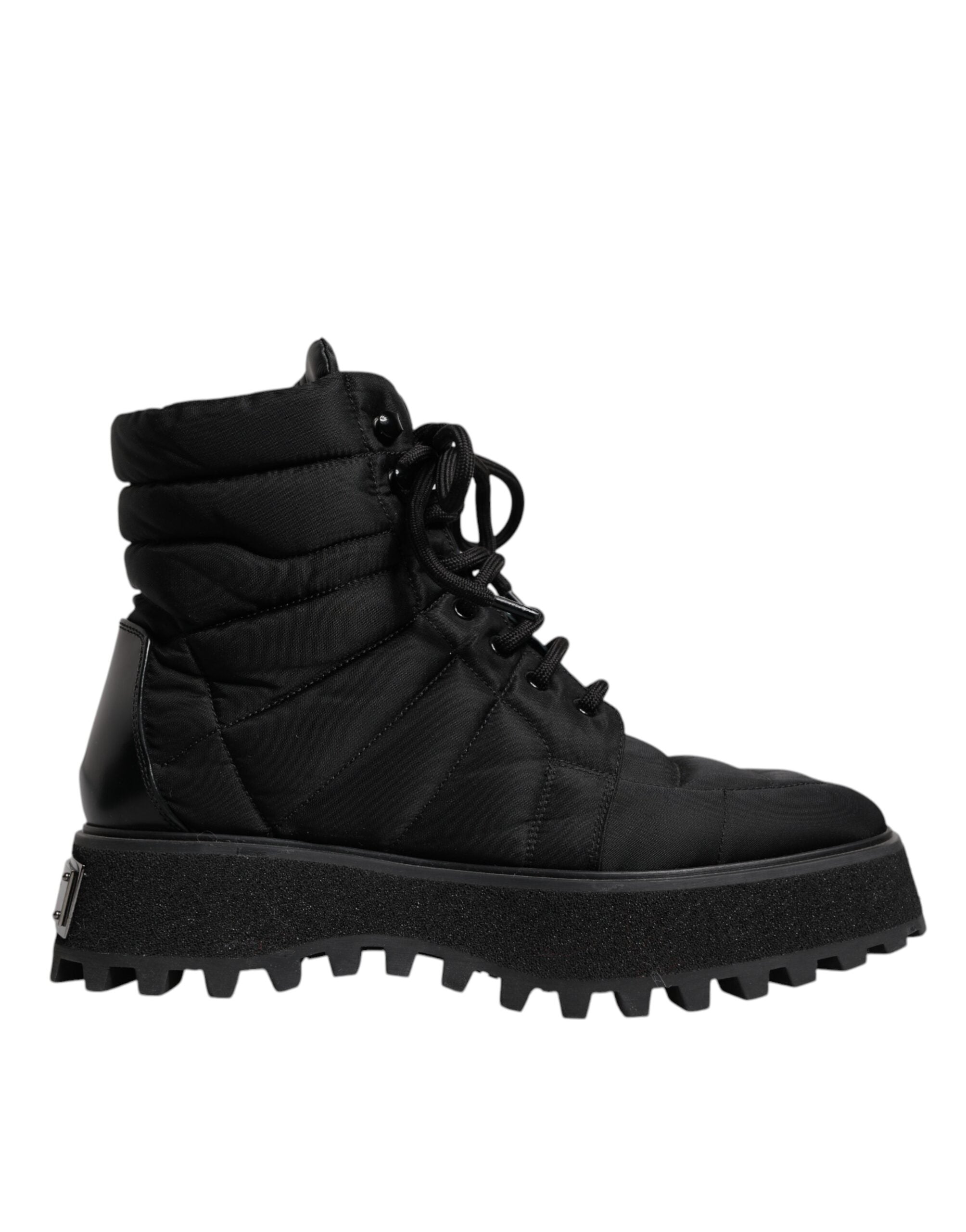 Bottes noires Dolce & Gabbana rembourrées mi-mollet avec lacets, style élégant et moderne, en cuir robuste.