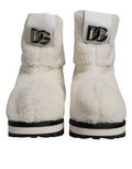 Bottes mi-mollet rembourrées blanches Dolce & Gabbana avec logo en relief et design élégant, parfaites pour un style chic.
