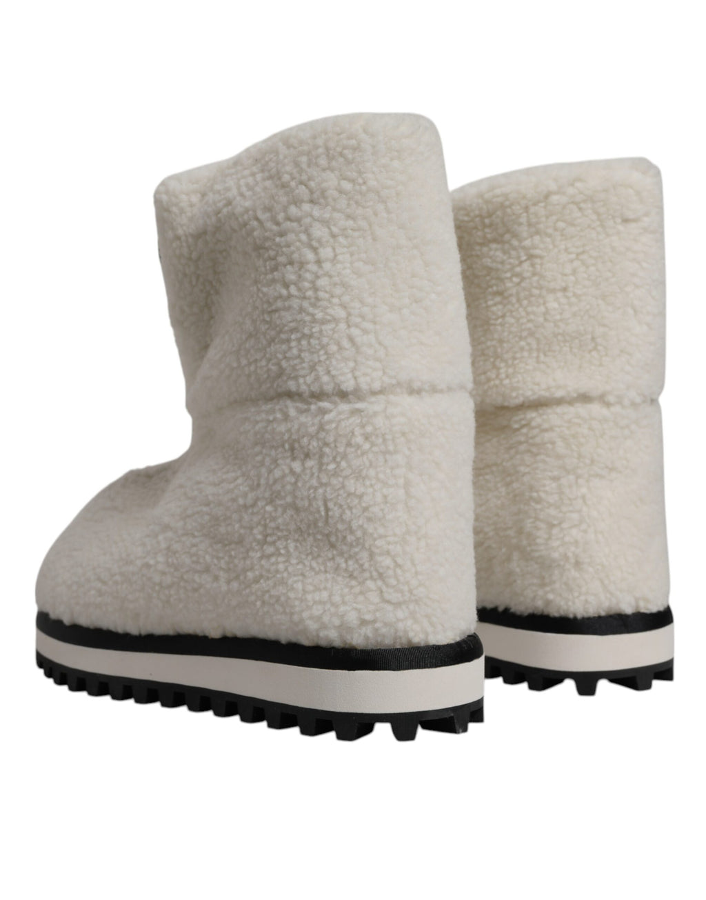 Bottes mi-mollet rembourrées blanches Dolce & Gabbana avec logo en peluche, style élégant et confortable.