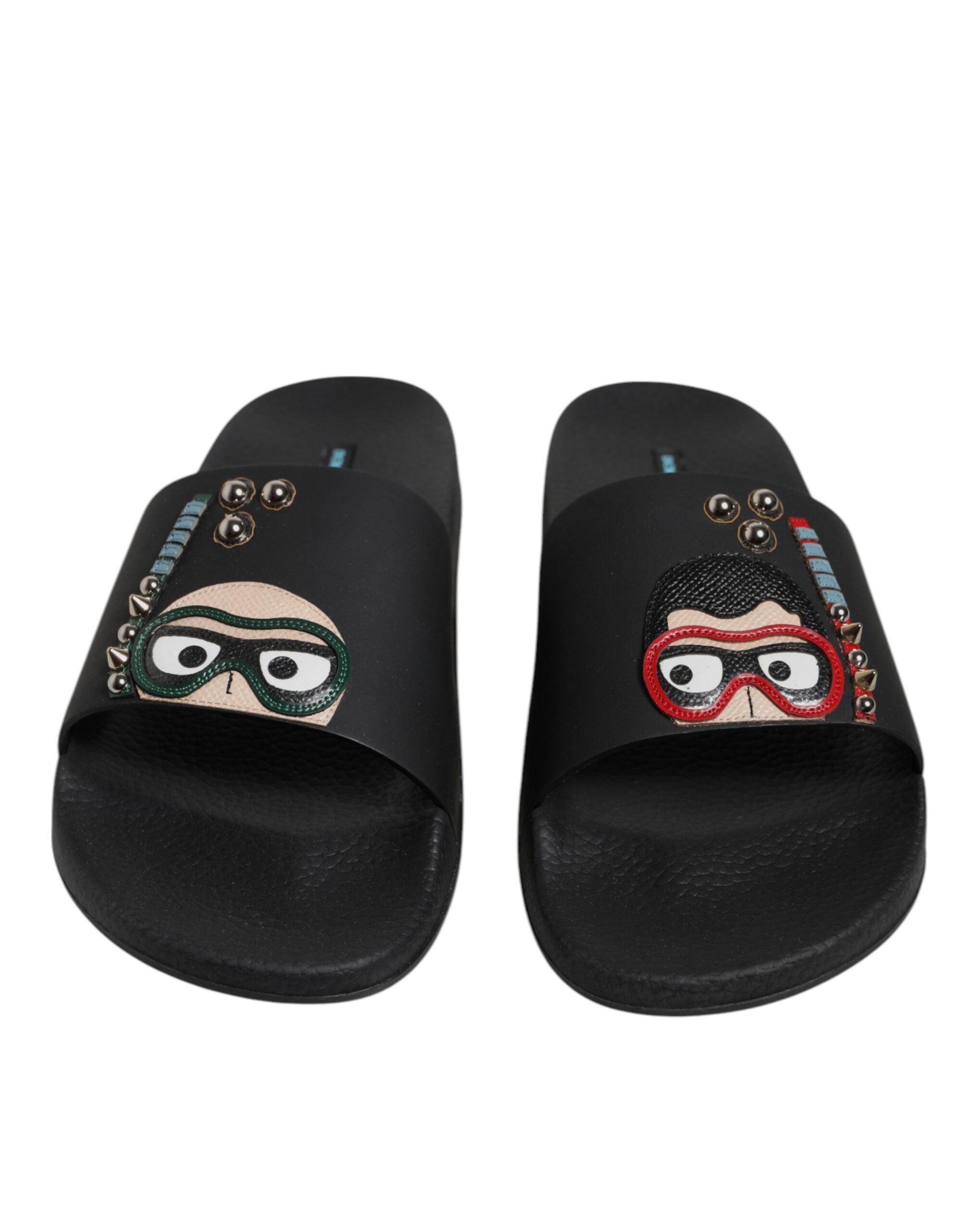 Sandales plates noires Dolce & Gabbana en cuir de plongée, parfaites pour la plage et le confort estival.