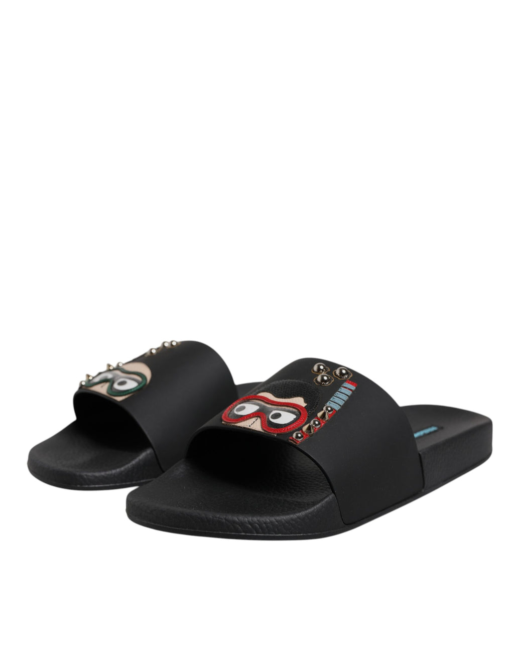 Sandales plates en cuir noir Dolce & Gabbana pour la plage, slides élégants et confortables pour femmes.