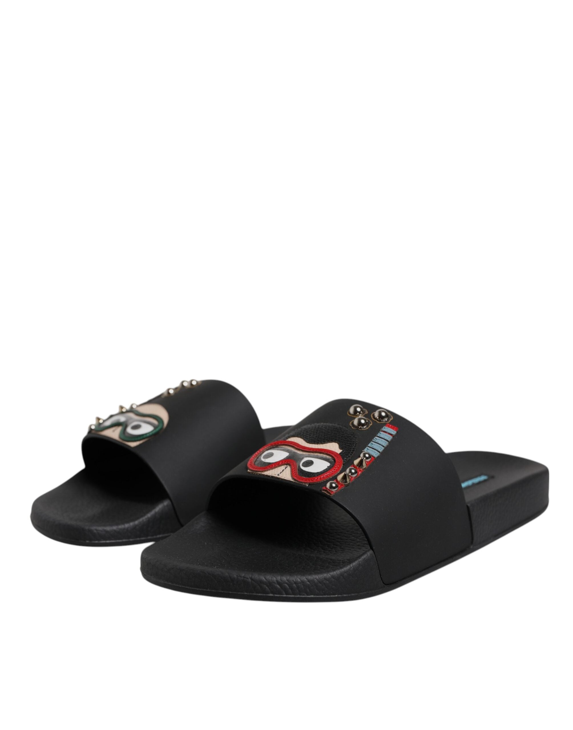 Sandales plates en cuir noir Dolce & Gabbana pour la plage, slides élégants et confortables pour femmes.
