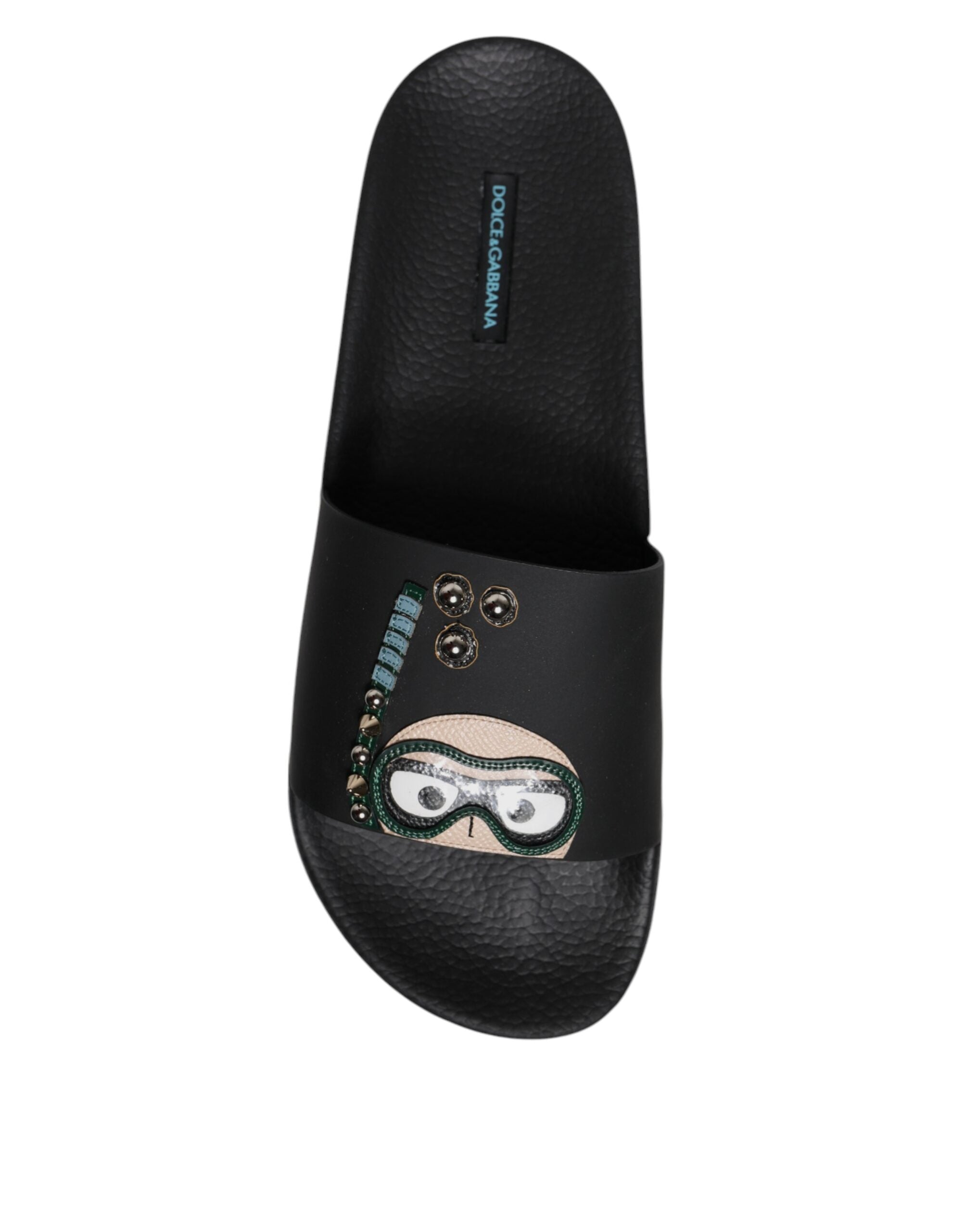 Sandales plates en cuir noir Dolce & Gabbana, chaussures de plage confortables et élégantes pour femmes.